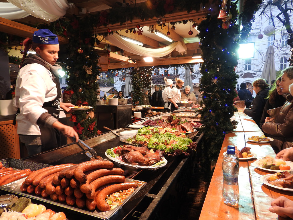 10 Delicious Food Markets Worth Traveling For During Christmas Season Budapest Christmas Fair Grilled Sausages meat.jpg