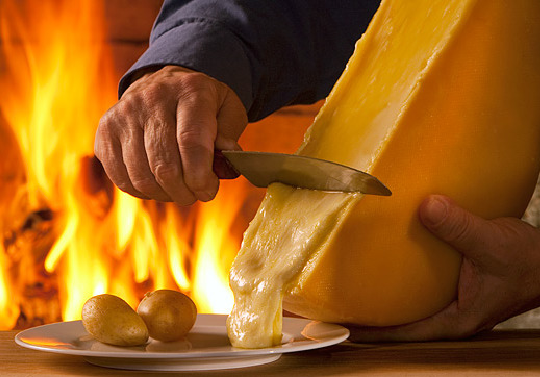 10 Must-Visit Christmas Markets Around the World for Foodies Zurich christkindlimarkt Raclette Swiss Melted Cheese